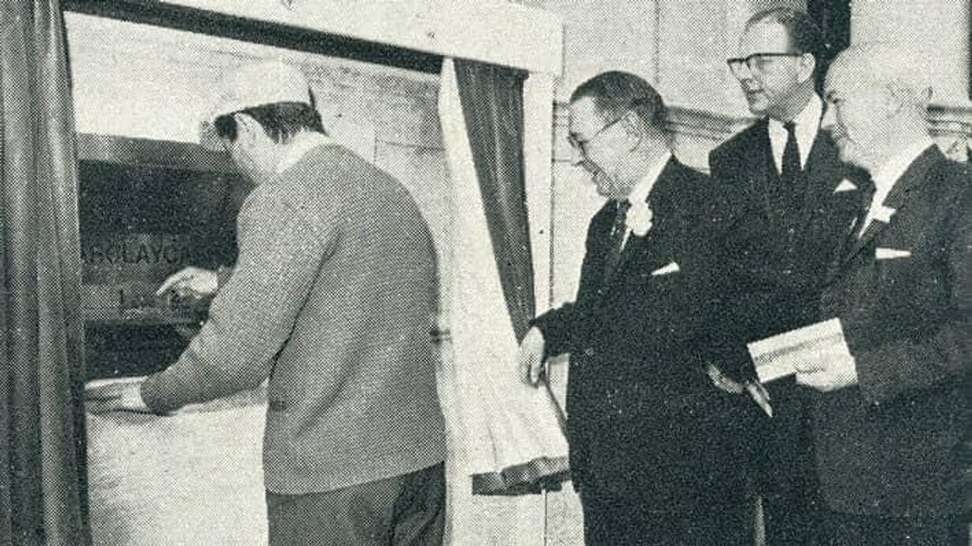 Reg Varney uses worlds first first cash machine image medium medium quality
